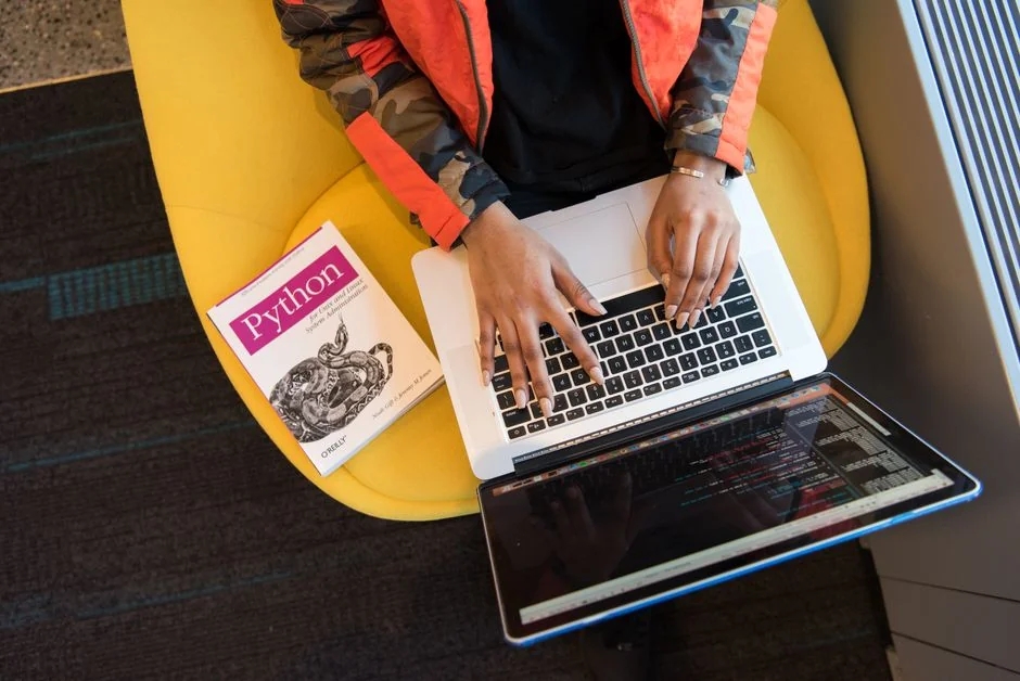 A concentrated designer is working on a project centered on users in a contemporary office setting.